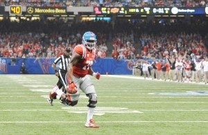 Ole Miss offensive lineman Laremy Tunsil (78) runs for a 2 yard touchdown against Oklahoma State in the Sugar Bowl at the Mercedes-Benz Superdome in New Orleans, La. on Friday, January 1, 2016. (AP Photo/Oxford Eagle, Bruce Newman)