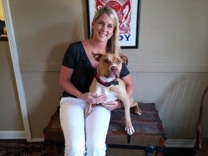 Laura Beth Cox shows off her foster pup, Toots, who is up for adoption.
