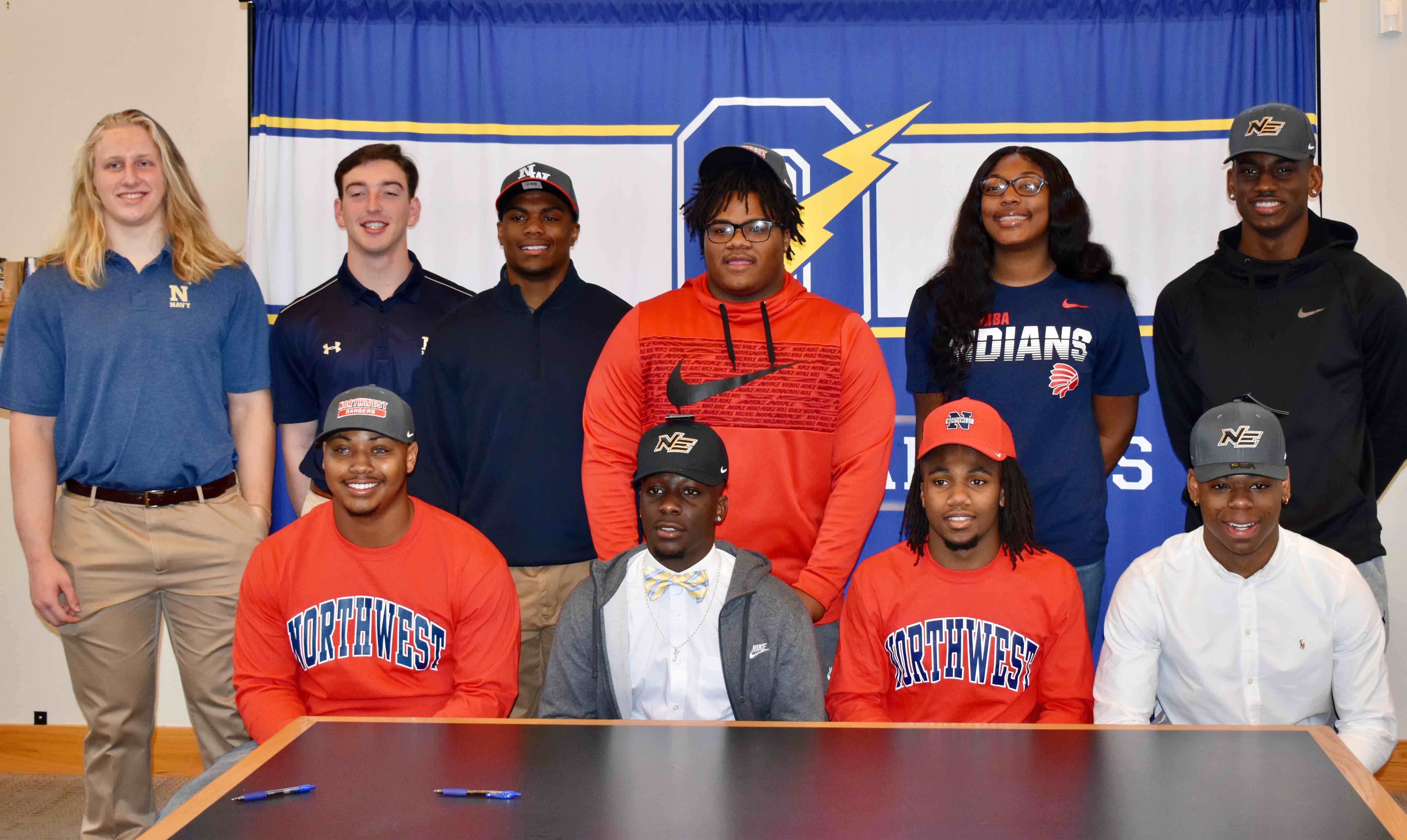 Ten sign at Oxford High School on National Signing Day The Oxford
